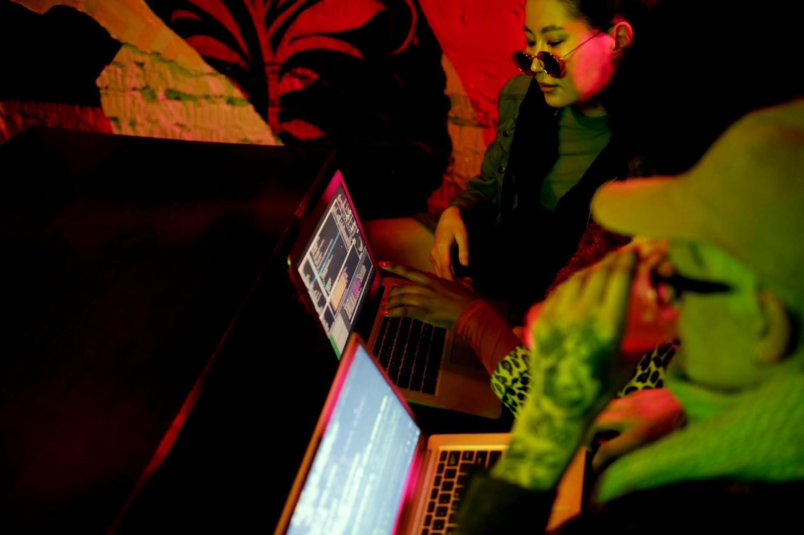 Development team reviewing API documentation and testing results on computer screens